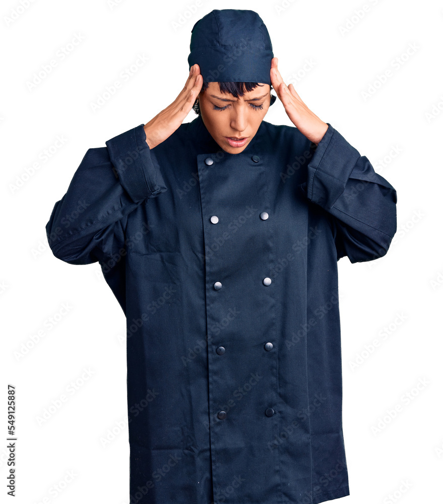 Young brunette woman with short hair wearing professional cook uniform with hand on head for pain in head because stress. suffering migraine. Young brunette woman with short hair wearing professional cook uniform with hand on head for pain in head because stress. suffering migraine.