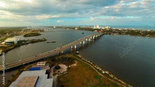 Wallpaper Mural Aerial Forward Shot Of Cars On Bridge Over Sea By News-Journal Center In City Under Cloudy Sky - Daytona Beach, Florida Torontodigital.ca