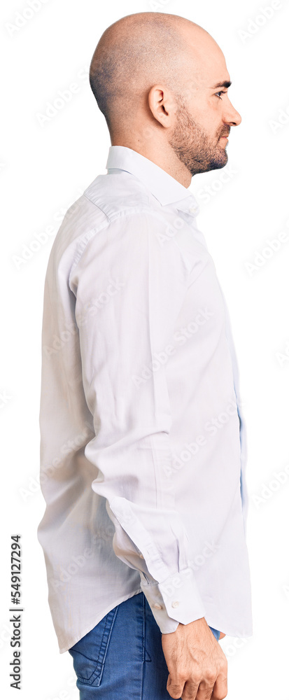 Young handsome man wearing elegant shirt looking to side, relax profile pose with natural face with confident smile. Young handsome man wearing elegant shirt looking to side, relax profile pose with natural face with confident smile.