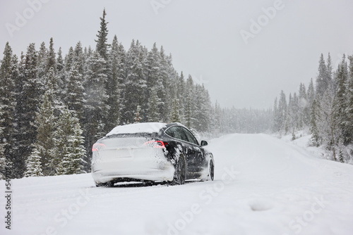 Electric car driving, mountains snow, National Park