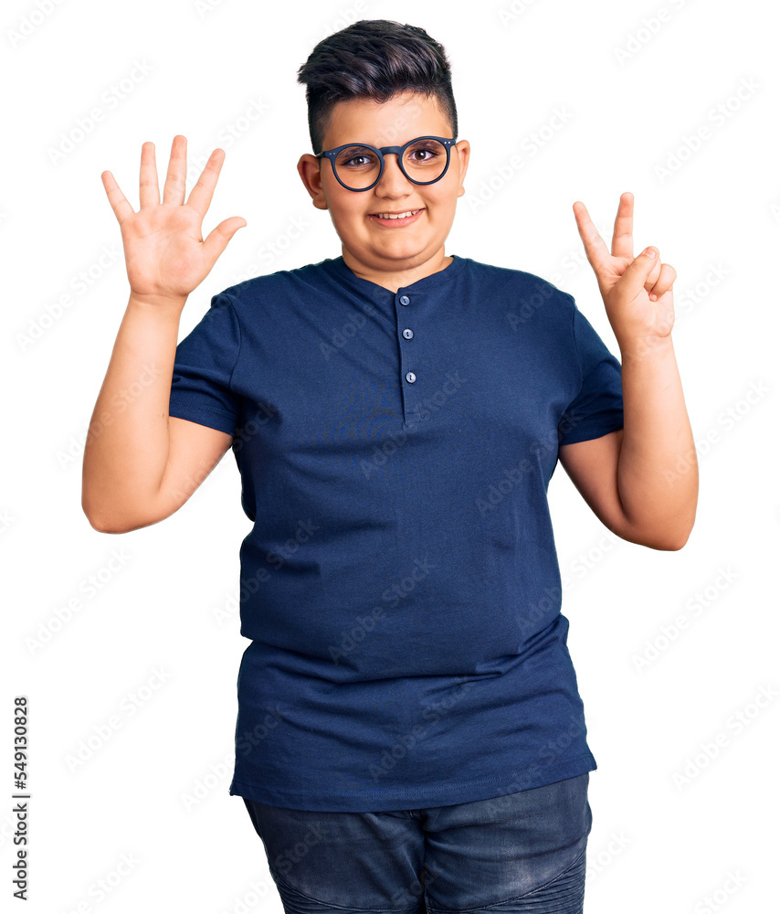 Little boy kid wearing casual clothes and glasses showing and pointing up with fingers number seven while smiling confident and happy. Little boy kid wearing casual clothes and glasses showing and pointing up with fingers number seven while smiling confident and happy.