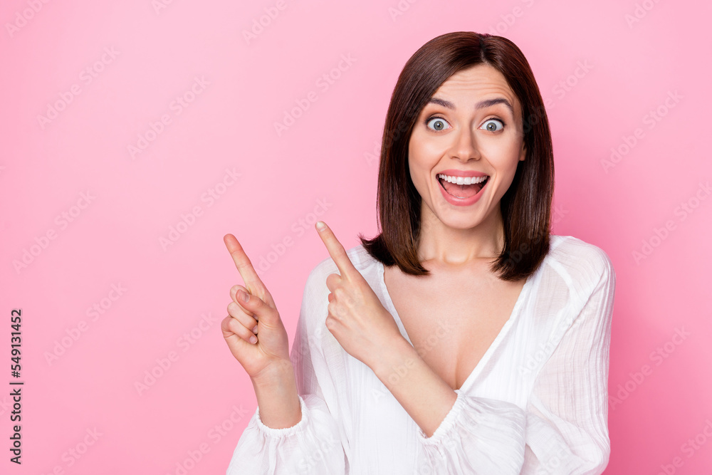 Photo portrait of nice young woman suggest advert space unbelievable sales dressed stylish white look isolated on pink color background Photo portrait of nice young woman suggest advert space unbelievable sales dressed stylish white look isolated on pink color background