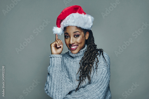 Young woman wearing Santa hat