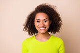 Close up photo of young lovely lady curly hair toothy smiling businesswoman wear stylish yellow look isolated on beige color background