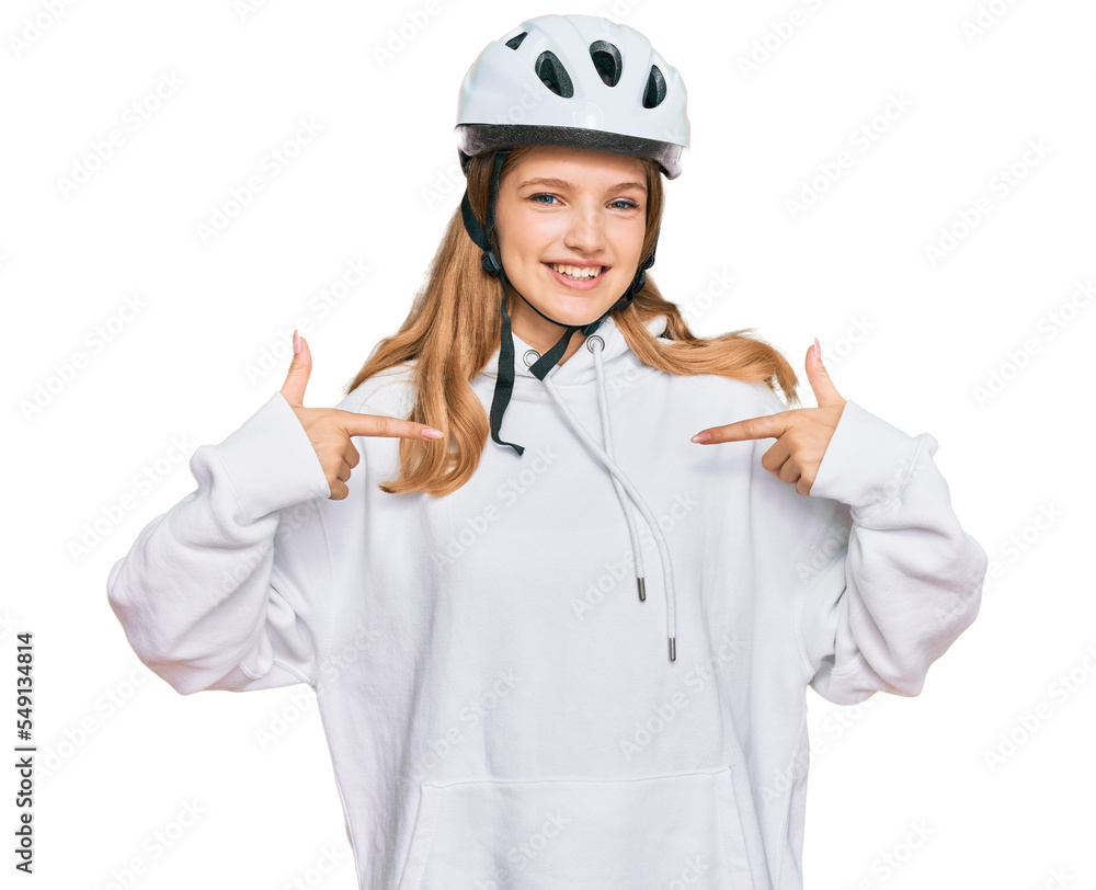 Beautiful young caucasian girl wearing bike helmet looking confident with smile on face, pointing oneself with fingers proud and happy. Beautiful young caucasian girl wearing bike helmet looking confident with smile on face, pointing oneself with fingers proud and happy.
