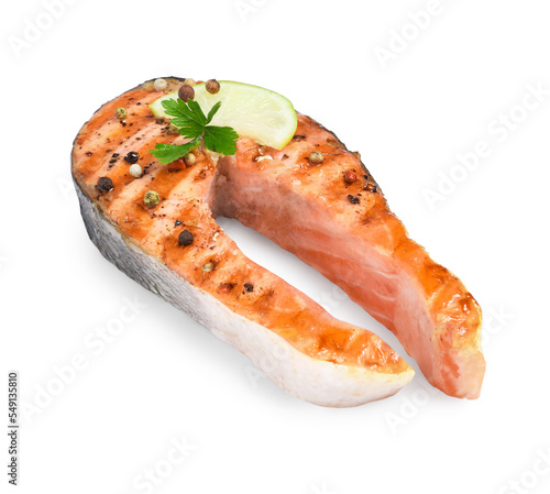 Tasty salmon steak with lemon, peppercorns and parsley isolated on white