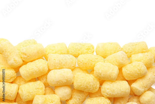 Many tasty corn puffs on white background, top view