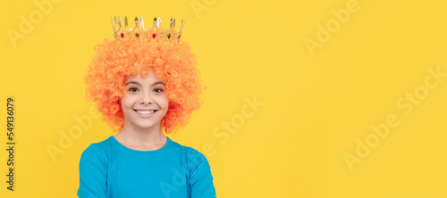 happy teen girl in fancy clown wig wear queen crown, girlish. Funny teenager child in wig, party poster. Banner header, copy space.