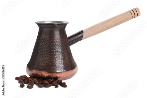 Metal turkish coffee pot and beans on white background