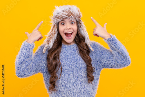Fototapeta teen girl in knitwear on yellow background