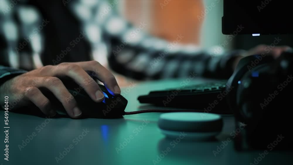 Male hands scrolling and typing on computer mouse and keyboard. Designer or data analyst developing a project. Freelancer at a modern home office, working and researching. Slow motion close up shot. Male hands scrolling and typing on computer mouse and keyboard. Designer or data analyst developing a project. Freelancer at a modern home office, working and researching. Slow motion close up shot.