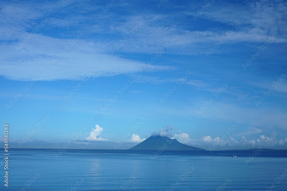 Old Manado mountain or island seen from Manado City.                              