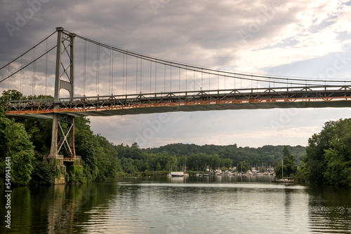 Kingston, NY - USA - Aug 2, 2022 Horizontal view of the iconic Wurts Street Bridge, spanning the Rondout Creek at sunset, in Kingston, New York.