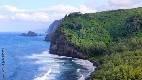 The black sand beach and Pololu Valley on the Big Island of Hawaii. photo