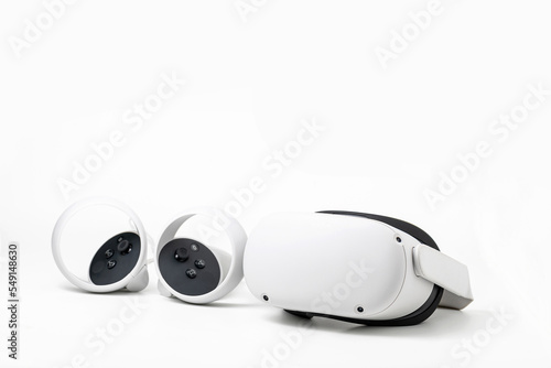White new Oculus Quest 2 virtual reality headset on white background with optional Elite headstrap attached photo