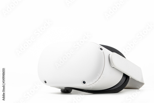 White new Oculus Quest 2 virtual reality headset on white background with optional Elite headstrap attached
