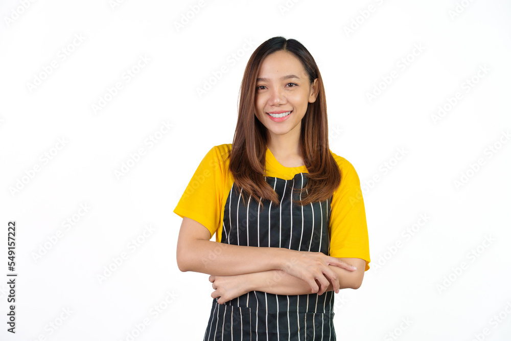 Looking to camera, Portrait of confident asian woman barista and food owner shop with yellow t-shirt and black apron standing on white background. Looking to camera, Portrait of confident asian woman barista and food owner shop with yellow t-shirt and black apron standing on white background.