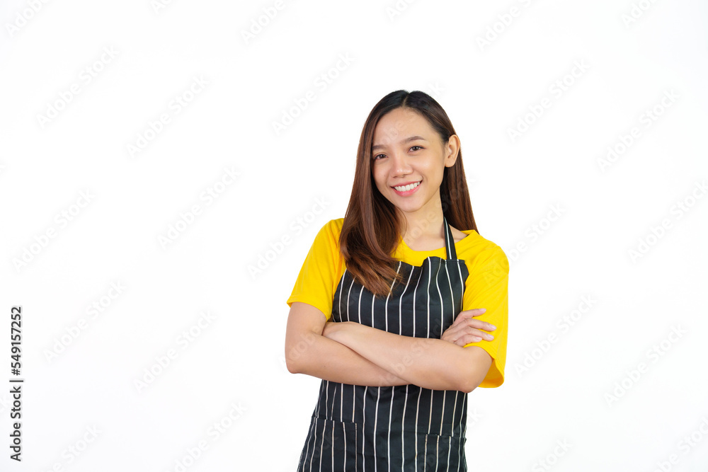 Looking to camera, Portrait of confident asian woman barista and food owner shop with yellow t-shirt and black apron standing on white background. Looking to camera, Portrait of confident asian woman barista and food owner shop with yellow t-shirt and black apron standing on white background.
