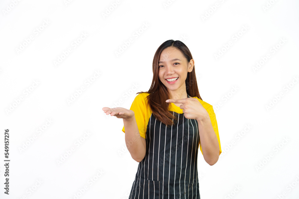 Looking to camera, Portrait of confident asian woman barista and food owner shop with yellow t-shirt and black apron standing on white background. Looking to camera, Portrait of confident asian woman barista and food owner shop with yellow t-shirt and black apron standing on white background.