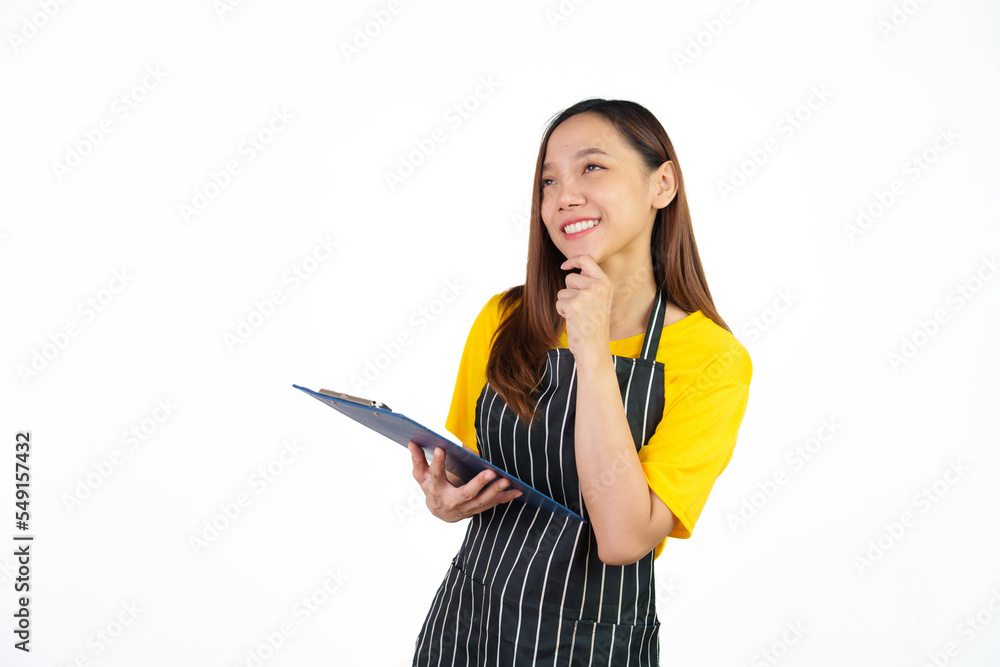 Holding menu on clipboard, Portrait of confident asian woman barista and food owner shop with yellow t-shirt and black apron standing on white background. Holding menu on clipboard, Portrait of confident asian woman barista and food owner shop with yellow t-shirt and black apron standing on white background.