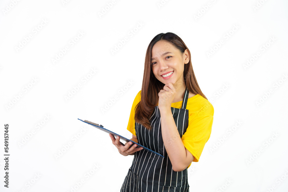 Holding menu on clipboard, Portrait of confident asian woman barista and food owner shop with yellow t-shirt and black apron standing on white background. Holding menu on clipboard, Portrait of confident asian woman barista and food owner shop with yellow t-shirt and black apron standing on white background.