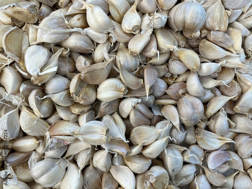 A background of garlic in a supermarket. Garlic usually used as one of ingredient in Asian cuisine. A background of garlic in a supermarket. Garlic usually used as one of ingredient in Asian cuisine.