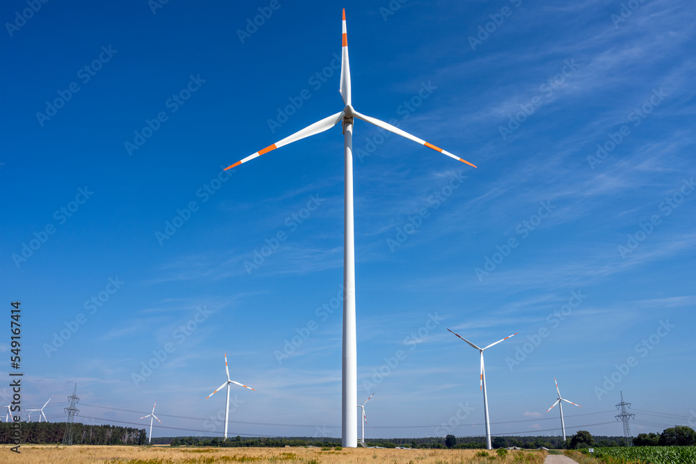 Modern wind turbines with power lines seen in Germany Modern wind turbines with power lines seen in Germany