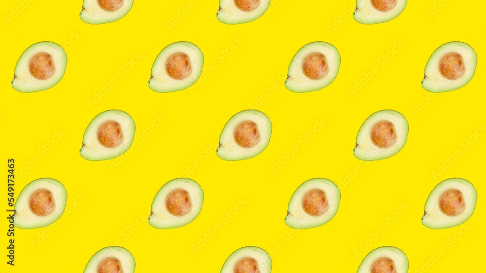 A half of Avocado with seed in seamless loop pattern on a yellow background. Exotic fruits in seamless loop animation. Endless food motion graphic background A half of Avocado with seed in seamless loop pattern on a yellow background. Exotic fruits in seamless loop animation. Endless food motion graphic background