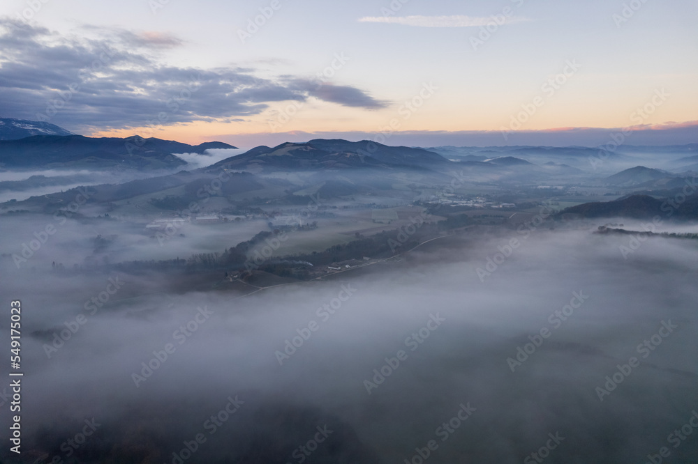 Aerial view of foggy morning in Marche region in Italy
