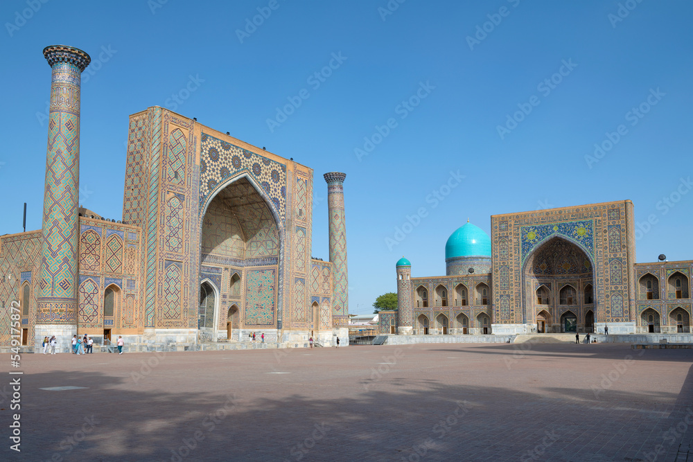 Ulugbek madrasah and Sherdor madrasah on Registan square on a sunny morning, Samarkand, Uzbekistan