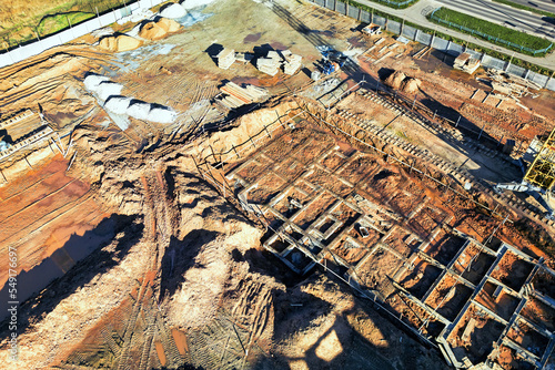 construction site in the city. Foundation pit for the construction of an underground garage under the apartment building. view from above. drone photography. Earthworks in construction.