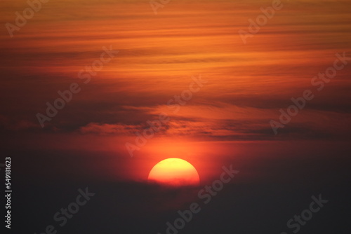 Fototapeta Naklejka Na Ścianę i Meble -  Beautiful orange sunset over the clouds