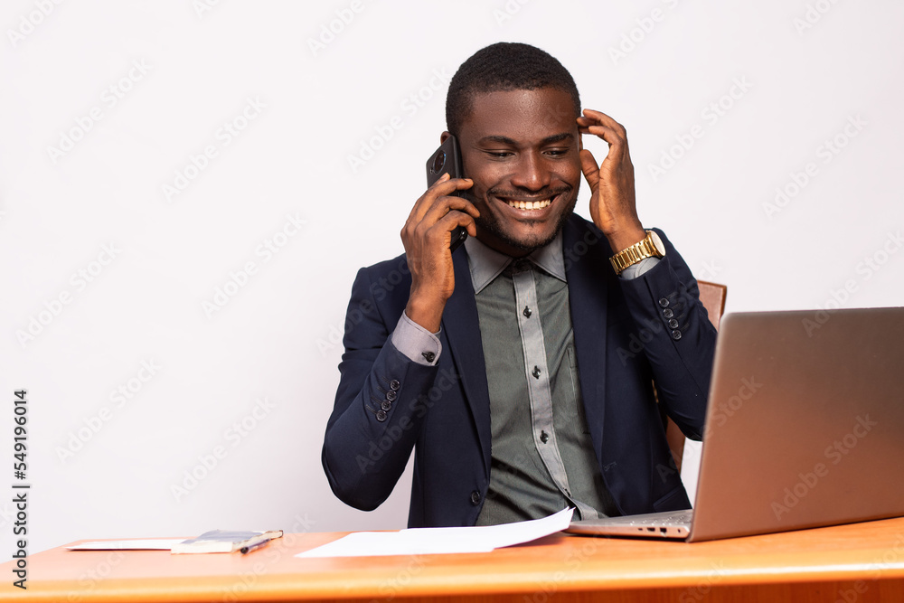 business man making a phone call while working business man making a phone call while working