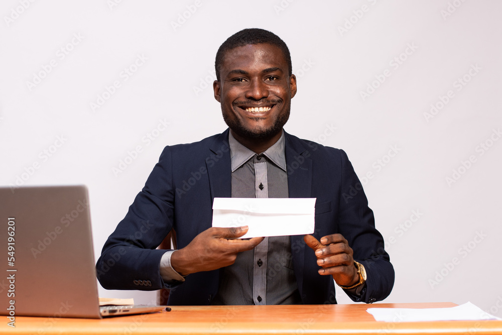 businessman holding an envelope businessman holding an envelope