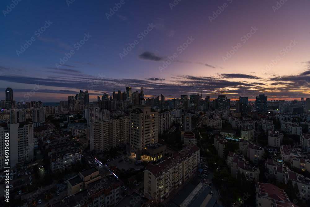 Twilight sunset view of Architectural Skyline in Qingdao, a Modern Coastal City of Shandong Province, China