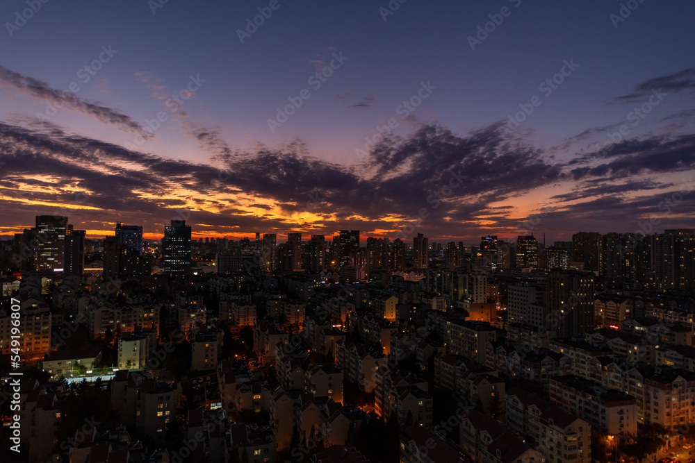 Beautiful aerial view of the center of a city in China country with tall buildings and blue sky twilight time.