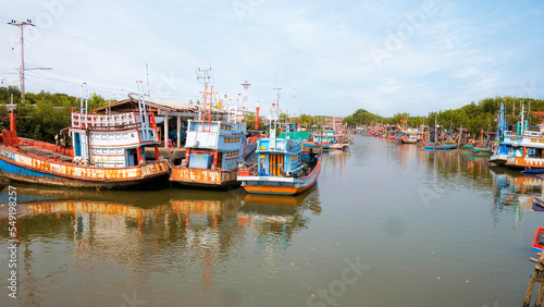 Group of old fishing boats docked in the fishing village of Thailand, Phetchaburi.