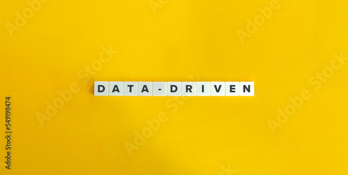 Data-driven Buzzword and Banner. Letter Tiles on Yellow Background. Minimal Aesthetics.