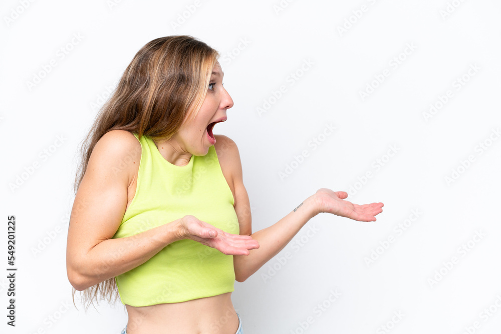 Young caucasian woman isolated on white background with surprise expression while looking side Young caucasian woman isolated on white background with surprise expression while looking side