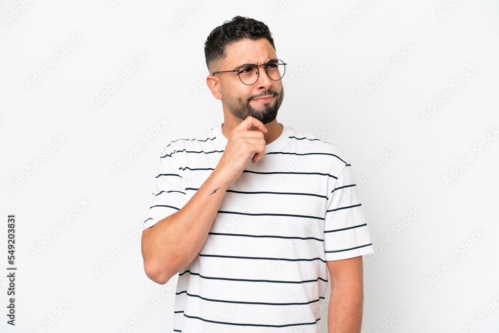 Young Arab handsome man isolated on white background having doubts and thinking Young Arab handsome man isolated on white background having doubts and thinking