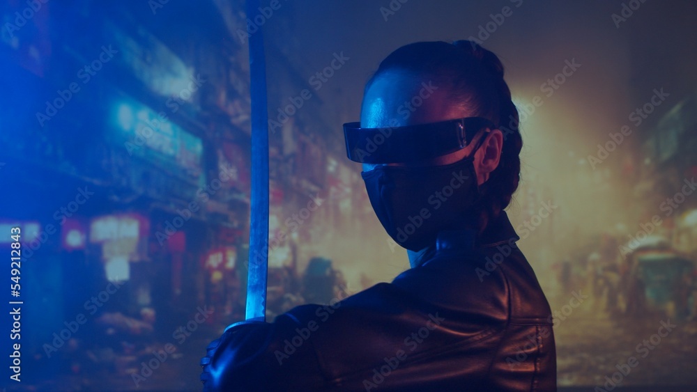 Cyberpunk ninja girl in a mask and with a katana. Beautiful female samurai woman on the background of Asian city downtown. Cyberpunk ninja girl in a mask and with a katana. Beautiful female samurai woman on the background of Asian city downtown.