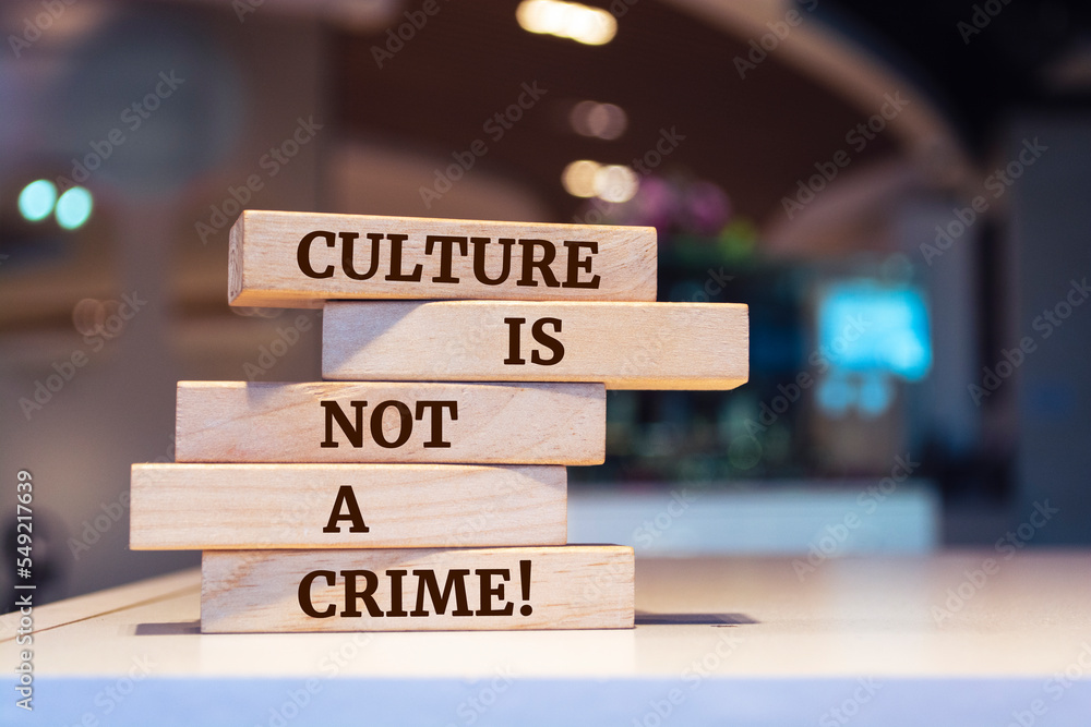 Wooden blocks with words 'Culture is not a Crime'.