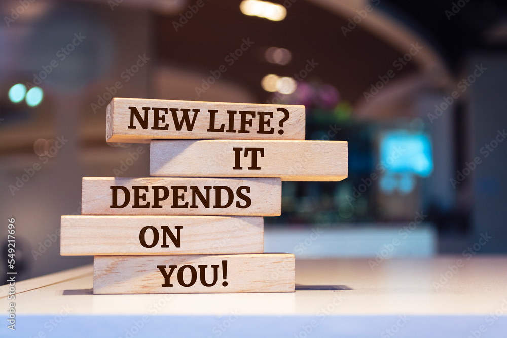 Wooden blocks with words 'New Life? It Depends on you!'.