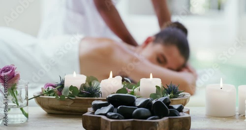 Relax, spa and candles for massage woman at luxury pamper resort for wellness in Brazil. Beauty, peace and therapy products foreground with calm girl client sleeping on massaging bed.