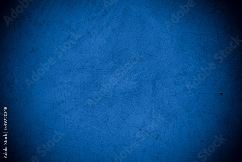 Old wall pattern texture cement blue dark abstract blue color design are light with black gradient background. © Kamjana