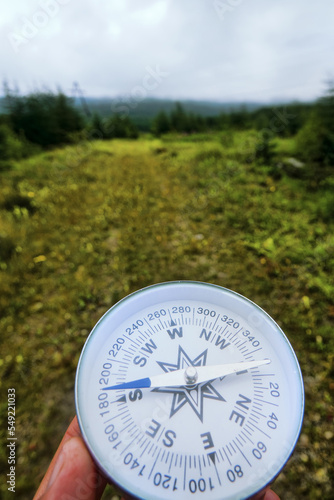 The right compass is always needed for travelers, adequate course. Taiga (boreal forest) . Magadan region photo