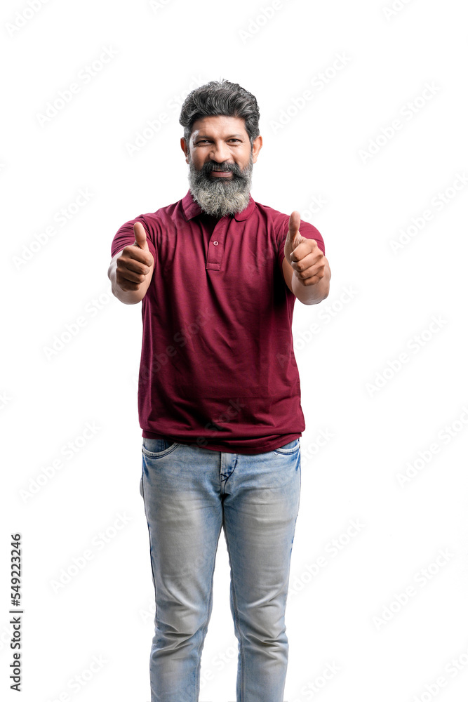 Indian man showing thumps up on white background. Indian man showing thumps up on white background.