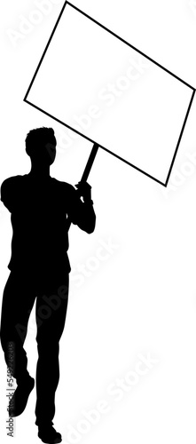 Protestor or demonstrator at a demonstration march, picket line or strike protest rally in silhouette. Holding up a banner or picket sign board placard.