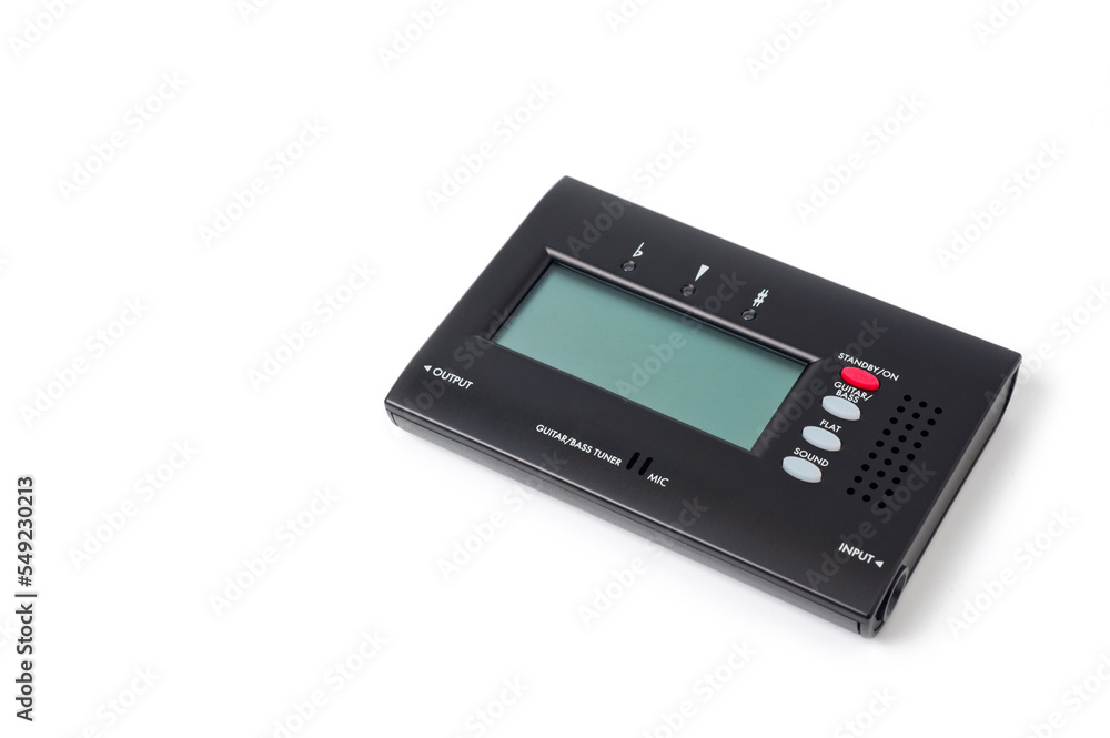 Tuner for tuning a bass guitar, compact, on a white background. Tuner for tuning a bass guitar, compact, on a white background.