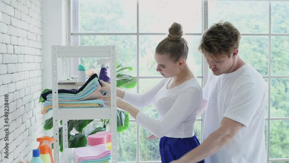 Family concept of 4k Resolution. Caucasian couple happily doing chores in the house. couples are in love with each other. Family concept of 4k Resolution. Caucasian couple happily doing chores in the house. couples are in love with each other.